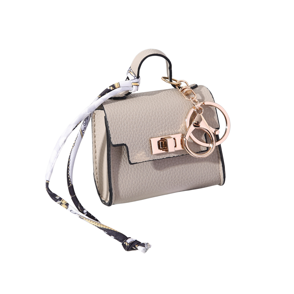 Beige mini-handbag style dog waste bag dispenser 